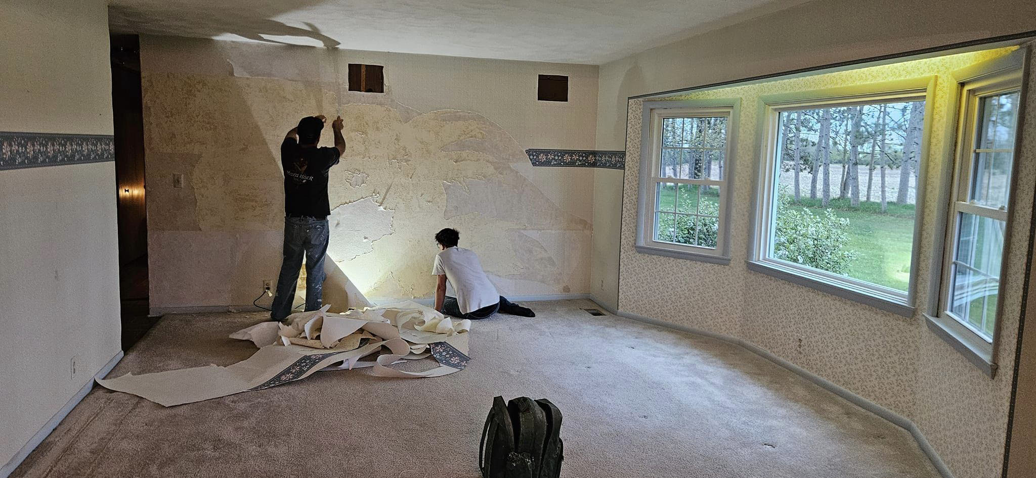 Interior of room before painting-stripping walllpaper